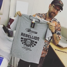 Coop putting the finishing touches on these tees we printed for @mettleptc #customTshirts #screenprinting #rebellionbrewing #yqr #strongman #doyouevenliftbro